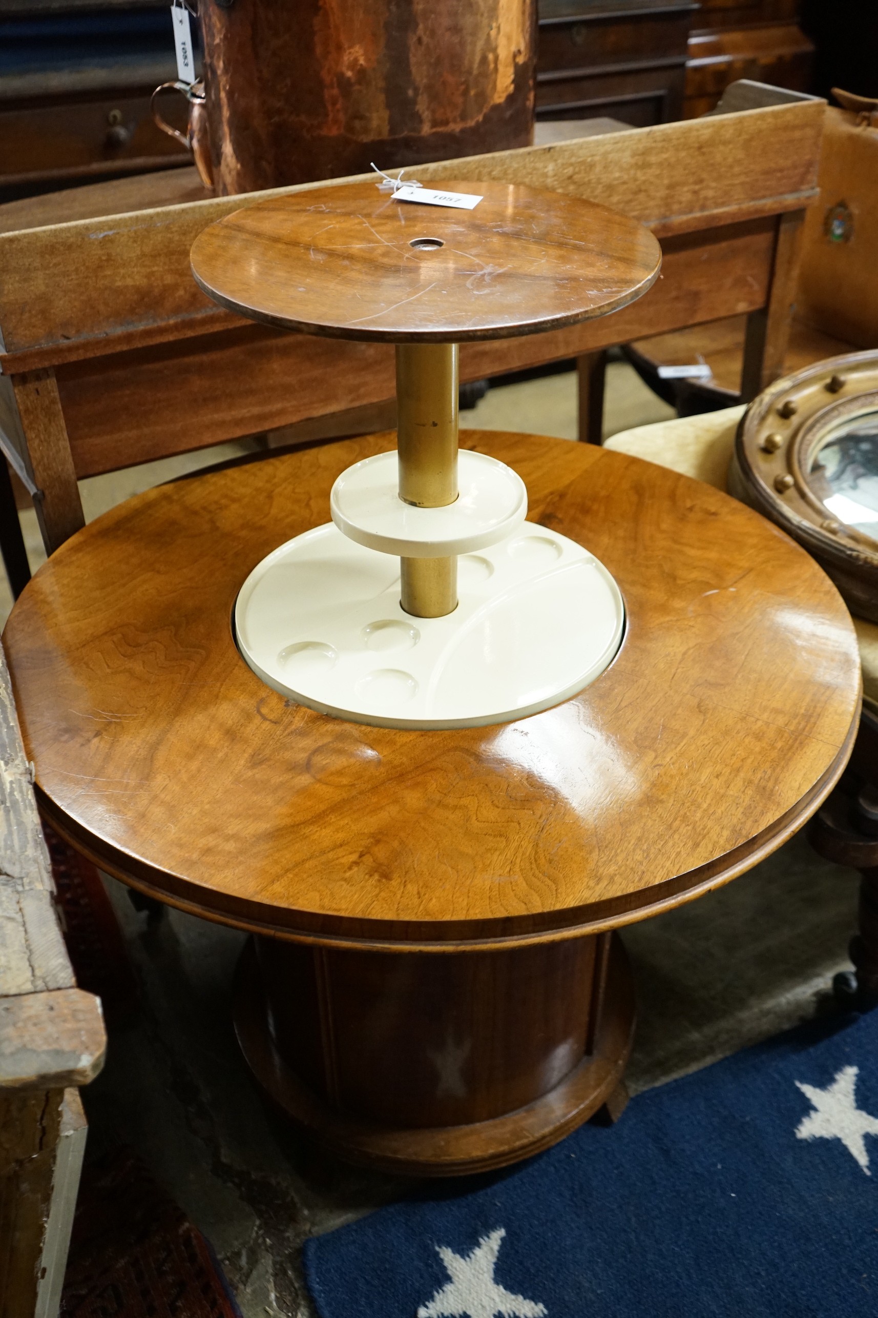 An Art Deco style circular walnut Patent Pop-up drinks table, diameter 80cm, length 92cm extended